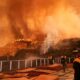 News updates: At least 16 dead in LA fires as dangerous winds could persist; crews douse roads in retardant